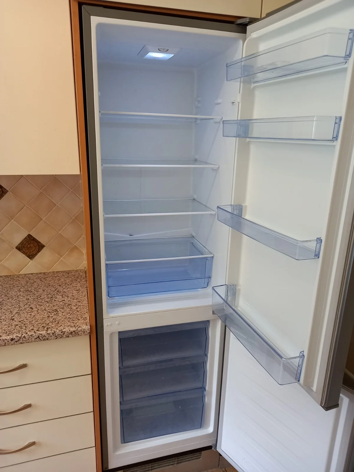 Refrigerator shelves, drawers and door bins cleaned inside